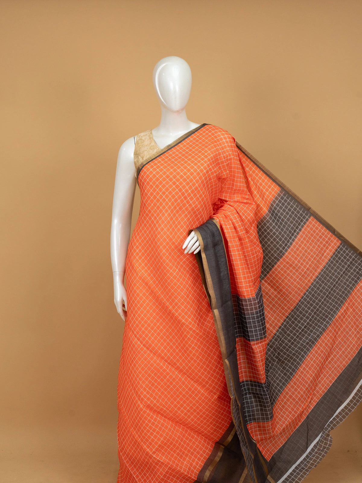 Orange linen cotton saree with white checks, contrast grey checked border and striped pallu
