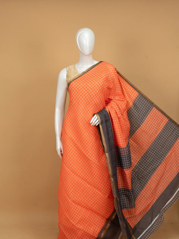 Orange linen cotton saree with white checks, contrast grey checked border and striped pallu