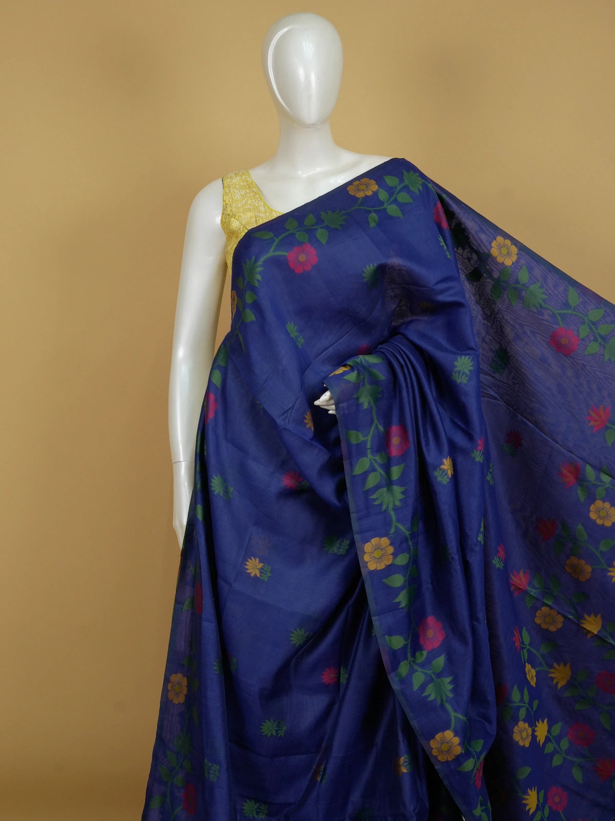 Royal blue linen cotton saree with multicolour woven floral motifs and a floral vine pallu