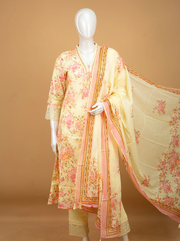 Yellow floral cotton Anarkali kurti set with beaded V-neck, lace cuffs, straight pants, and pink-bordered dupatta