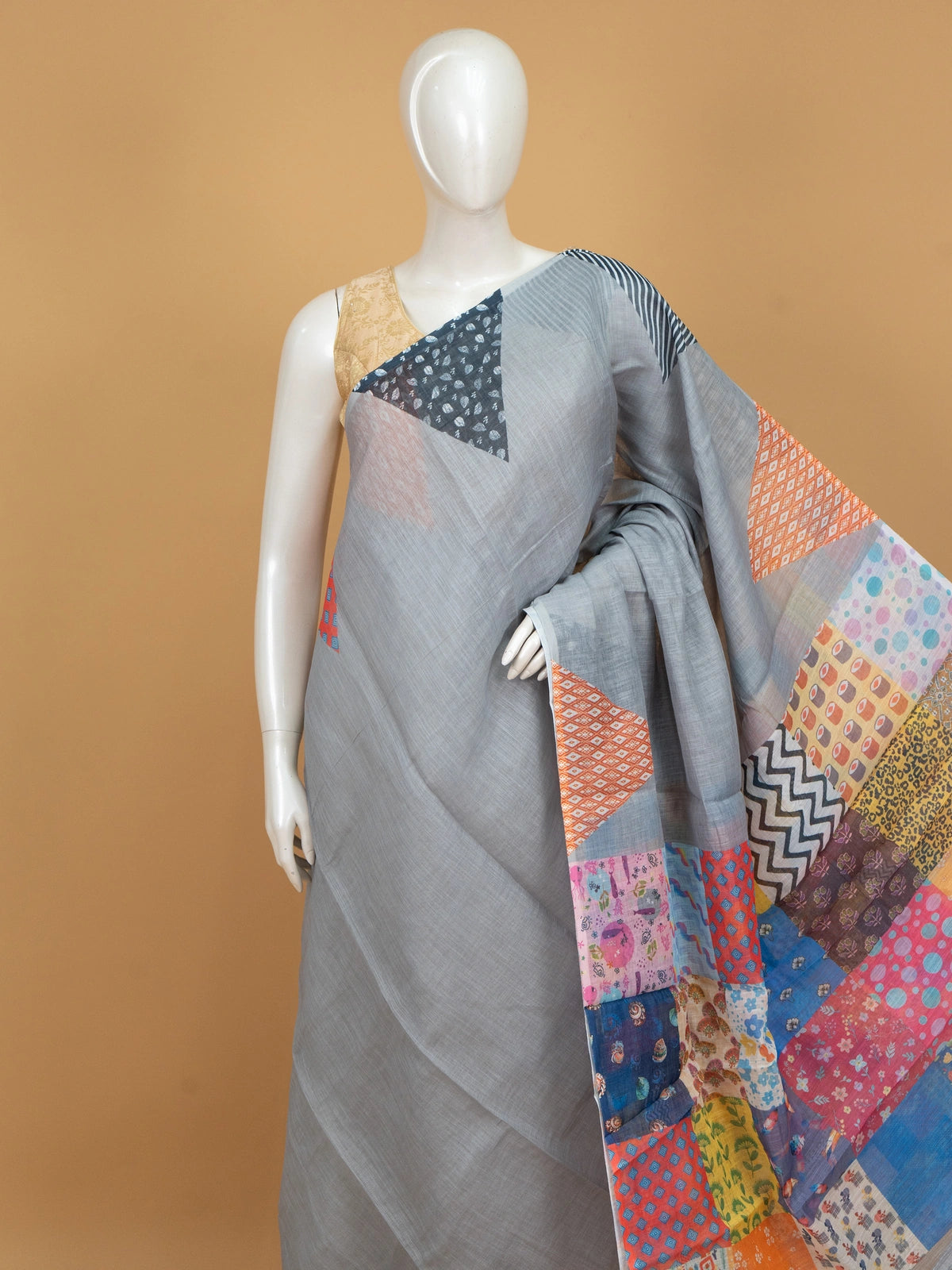 Grey linen cotton saree with multicolour patchwork print pallu and border