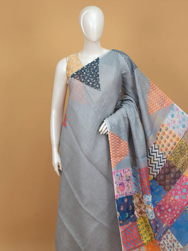 Grey linen cotton saree with multicolour patchwork print pallu and border