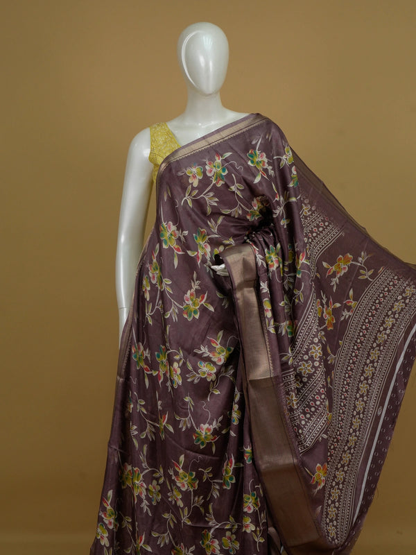 Mauve Dola silk saree with multicoloured floral print, gold zari border and yellow contrast blouse