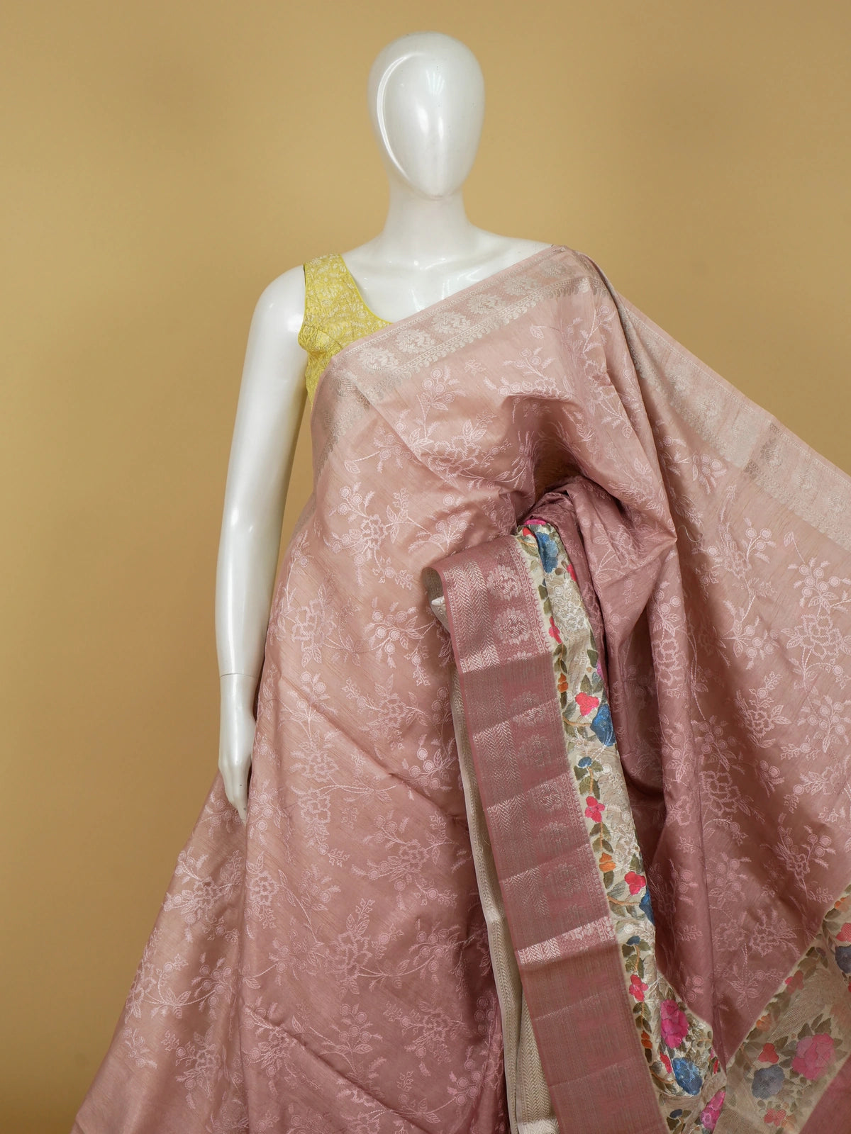 Dusty rose-pink designer saree with tonal floral embroidery and multicolour cream floral border