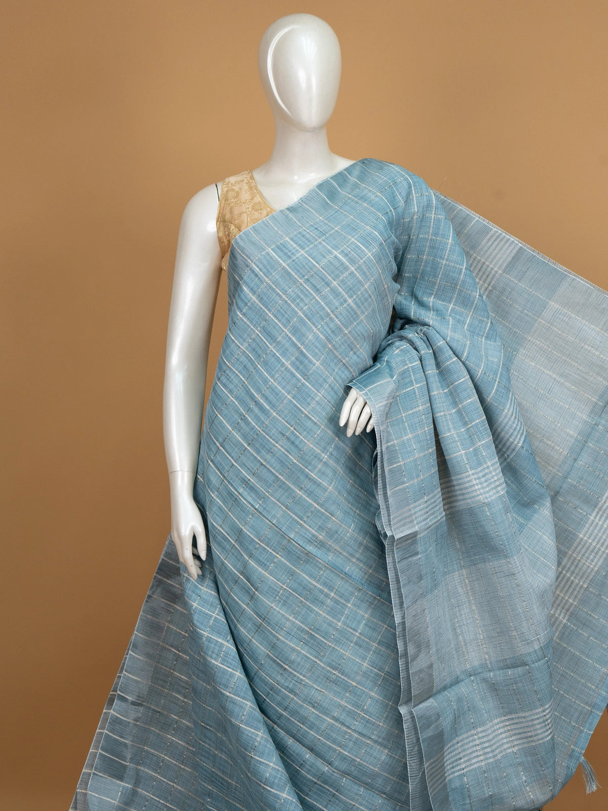 Sky blue linen cotton saree with white and silver zari checked weave and striped pallu