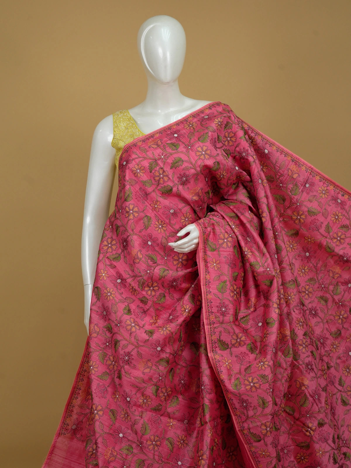 Pink semi tussar saree with multicoloured floral embroidery and contrast yellow blouse