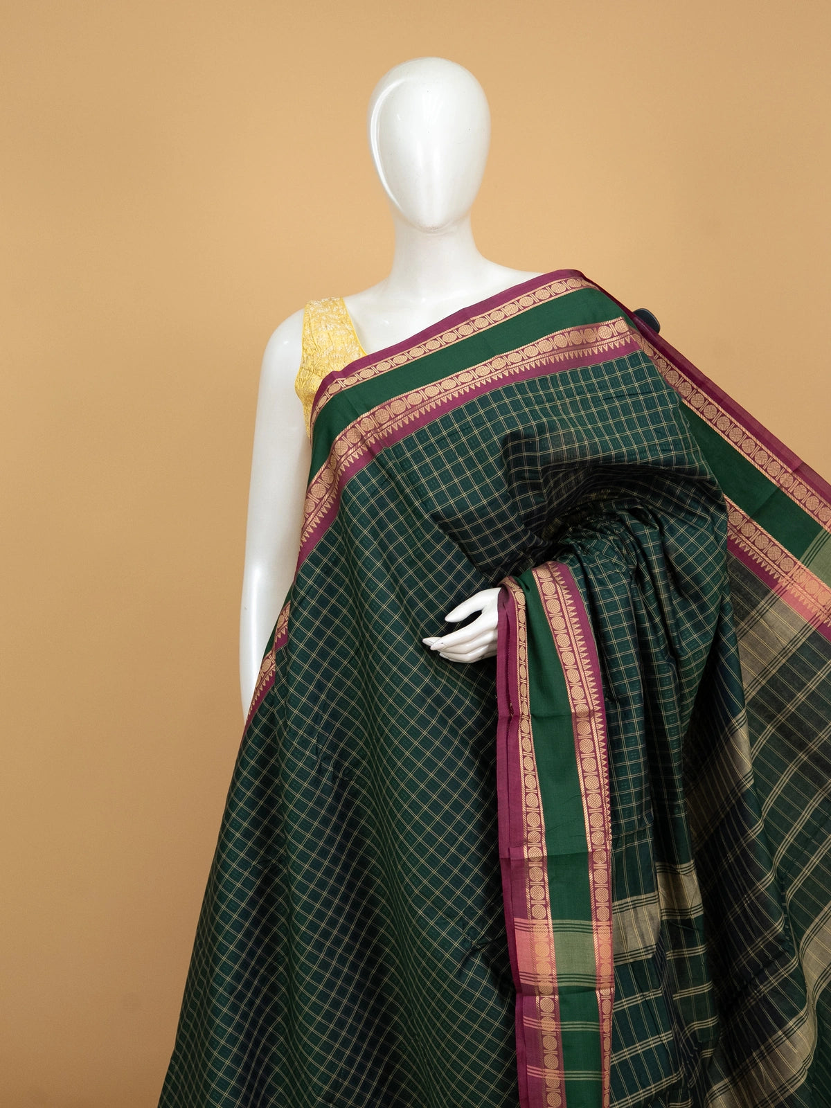 Dark green Chettinad cotton saree with gold checks and contrast magenta zari border