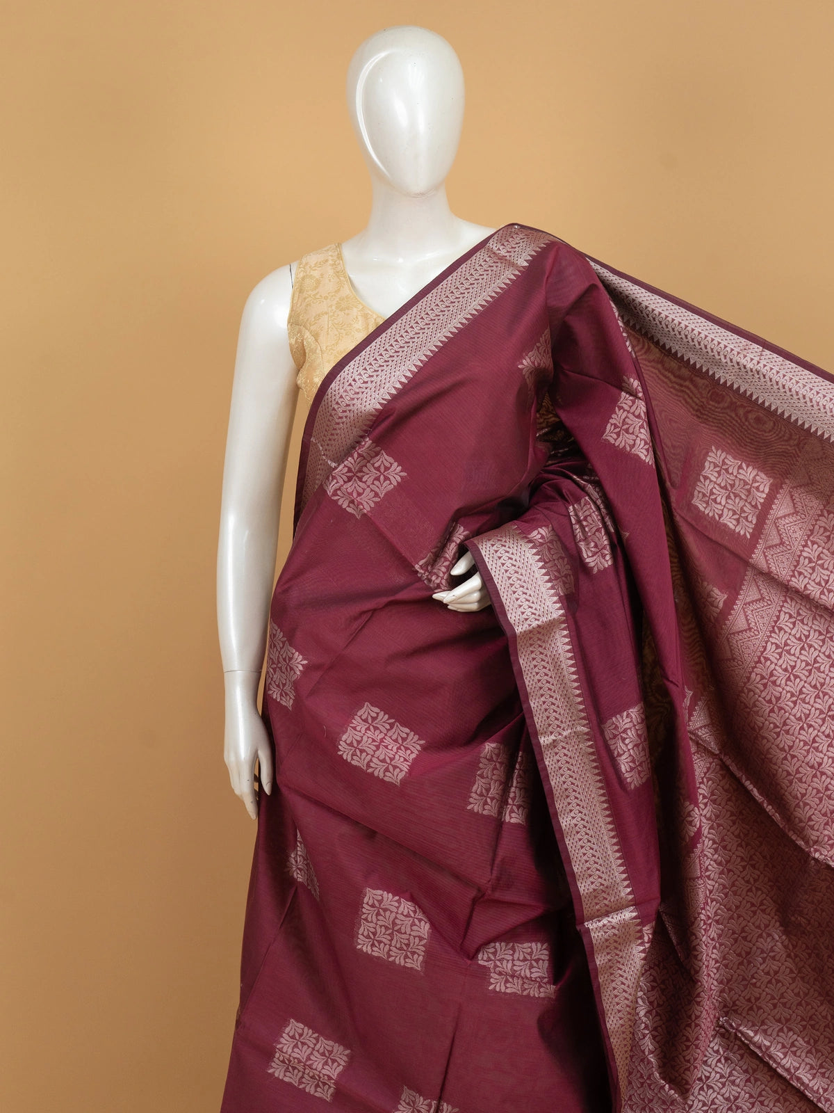 Maroon silk cotton saree with silver zari buttas and contrast woven border