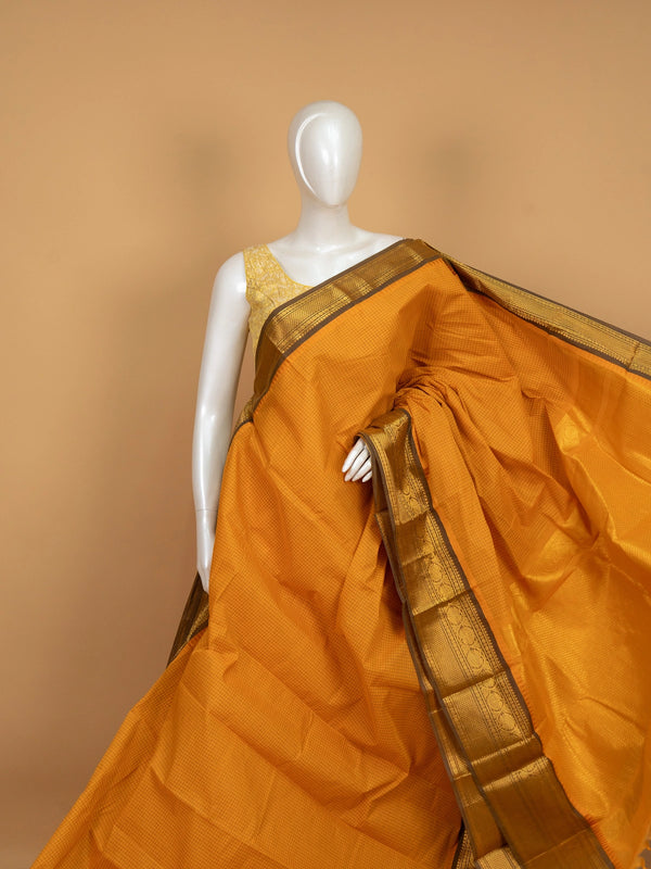 Mustard yellow Chettinad cotton saree with woven checks and contrast olive-brown gold zari border