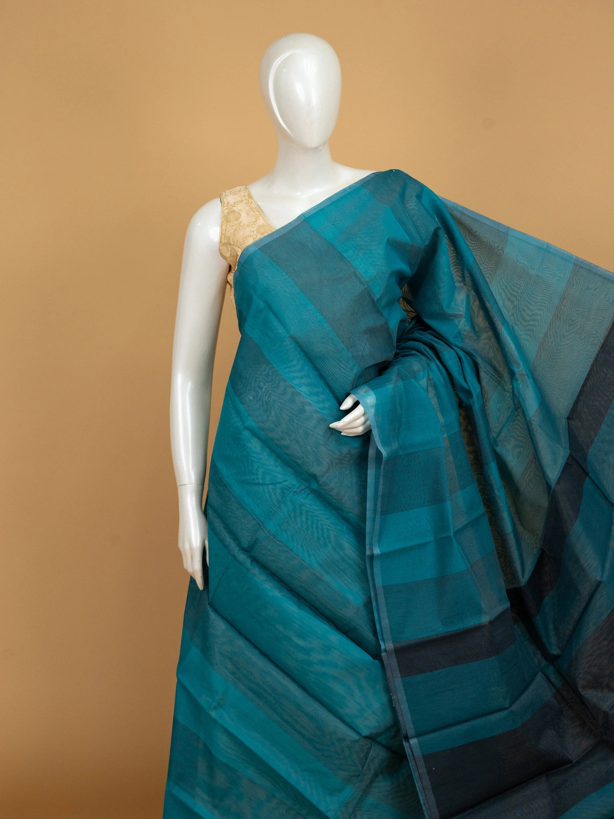 Teal blue silk cotton saree with tonal checks and contrast dark navy border