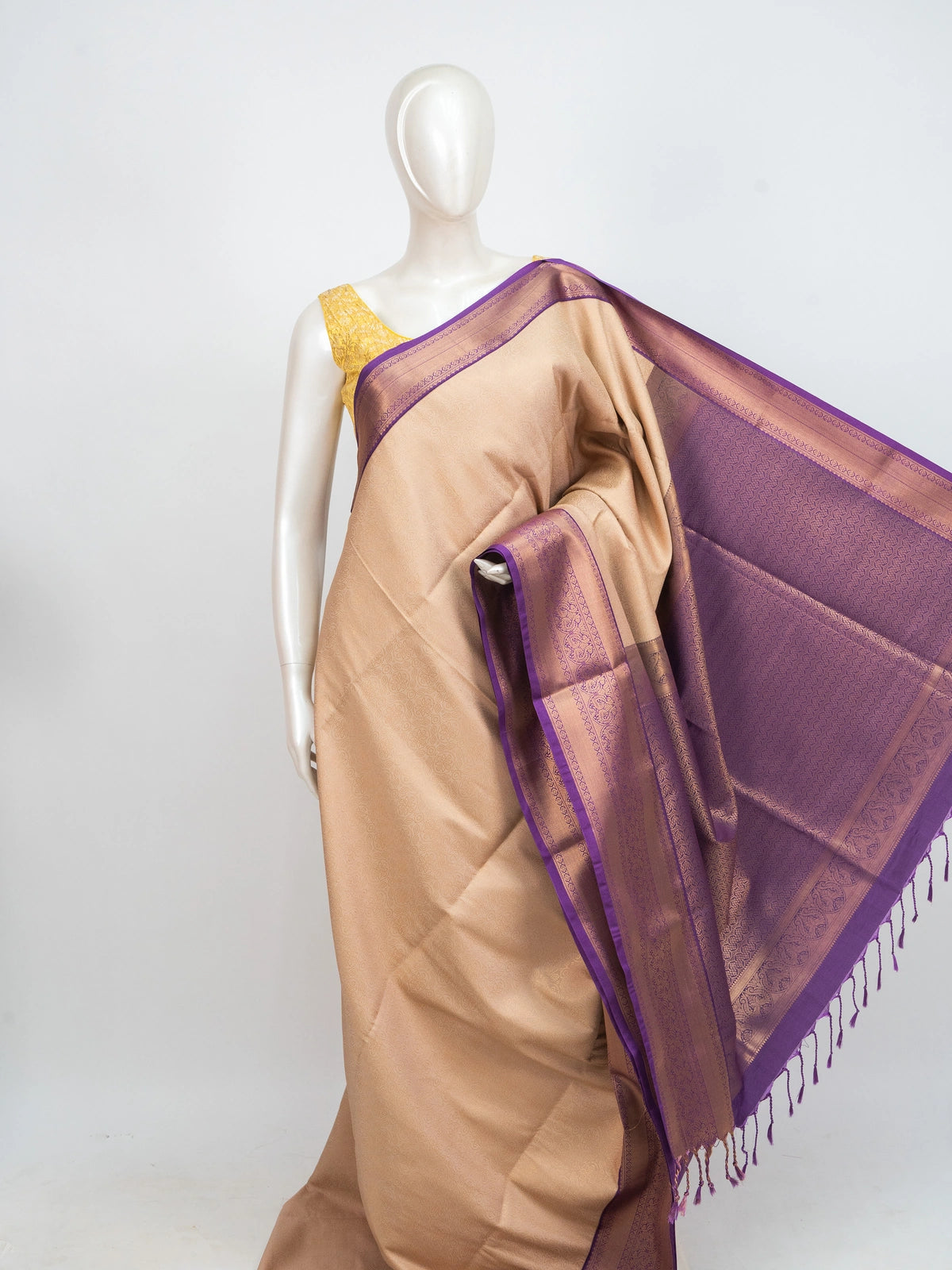 Beige Kanchipuram Fancy Silk saree with contrast purple and gold zari border and pallu