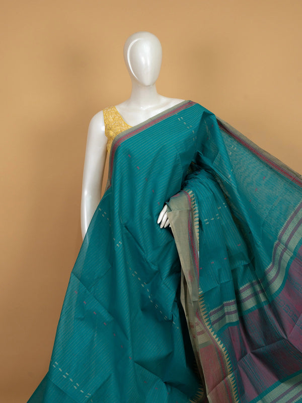 Teal green linen cotton saree with gold zari stripes, pink buti motifs and contrast grey temple border
