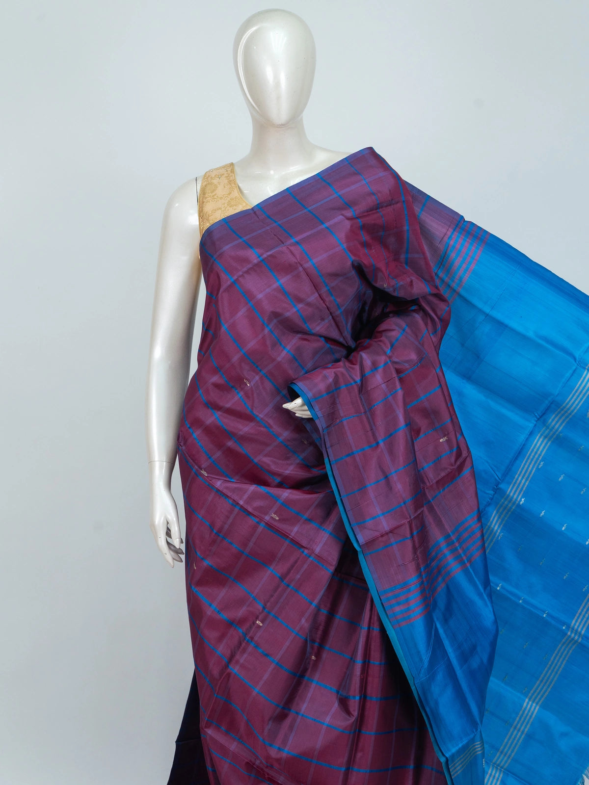 Purple and blue checked banana silk saree with contrast blue border and silver zari paisley pallu