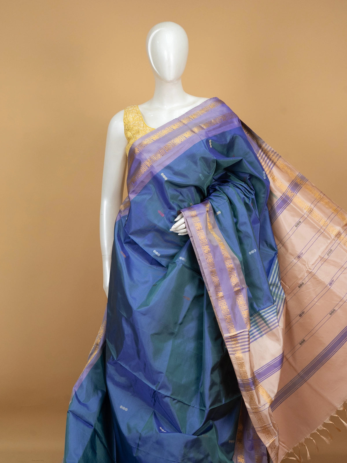 Peacock blue-green banana silk saree with lavender gold zari border and cream zari pallu