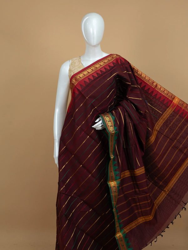 Maroon Chettinad cotton saree with gold zari stripes and green temple border