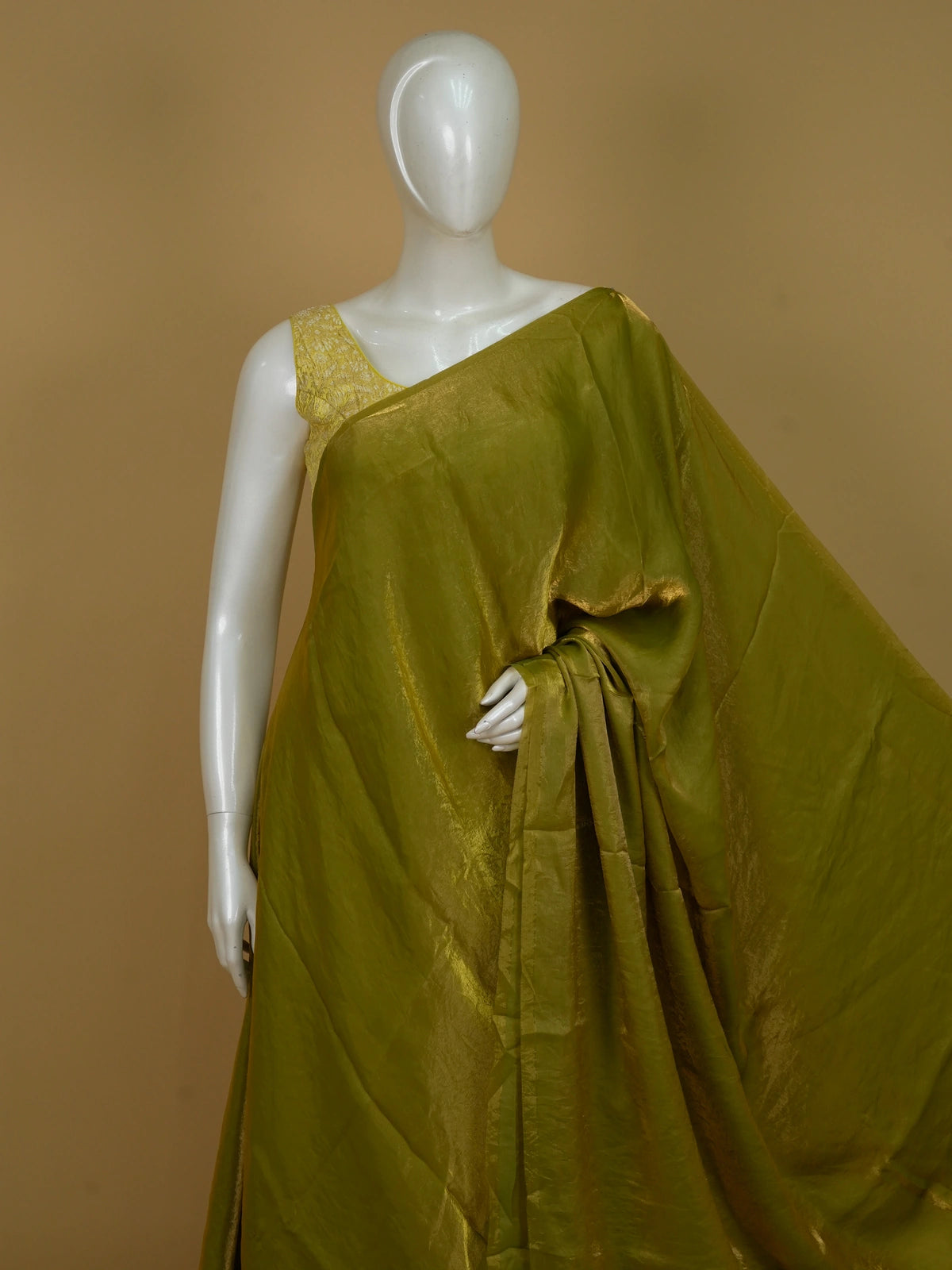Olive green and gold semi tussar saree with shimmering tissue weave and contrast printed floral blouse