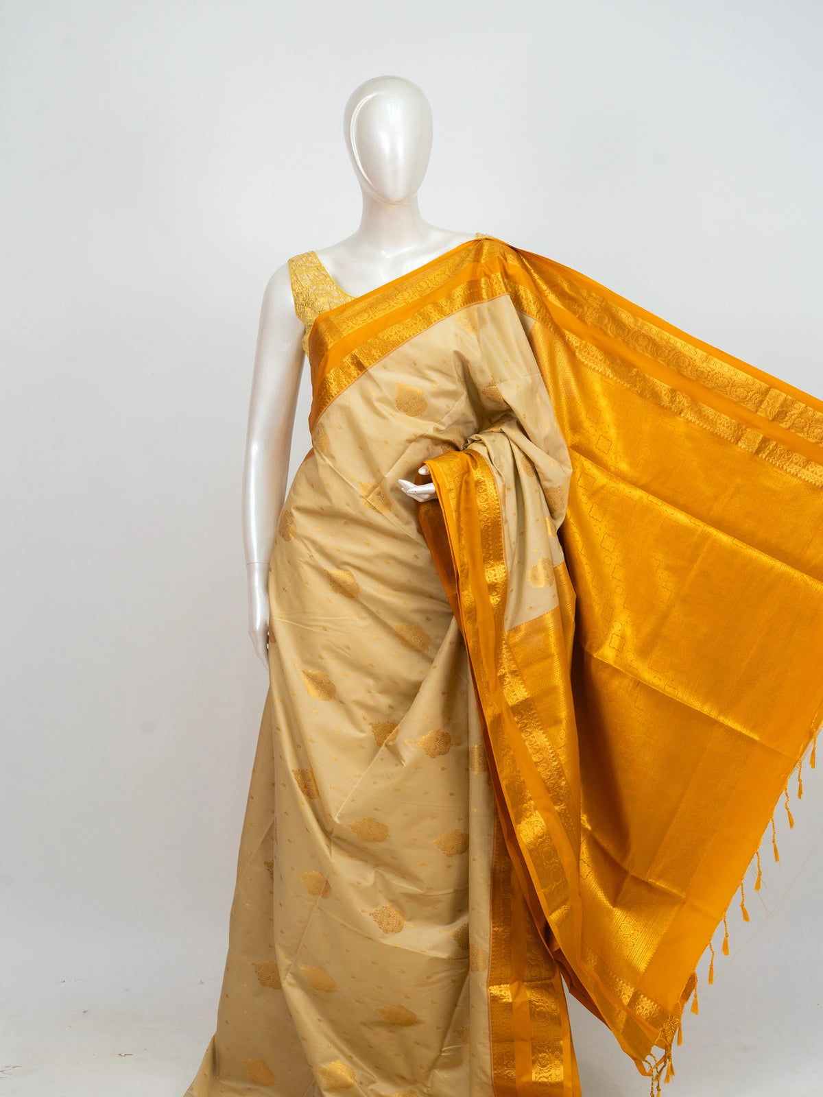 Cream Kanchipuram fancy silk saree with mustard yellow contrast border and gold zari pallu