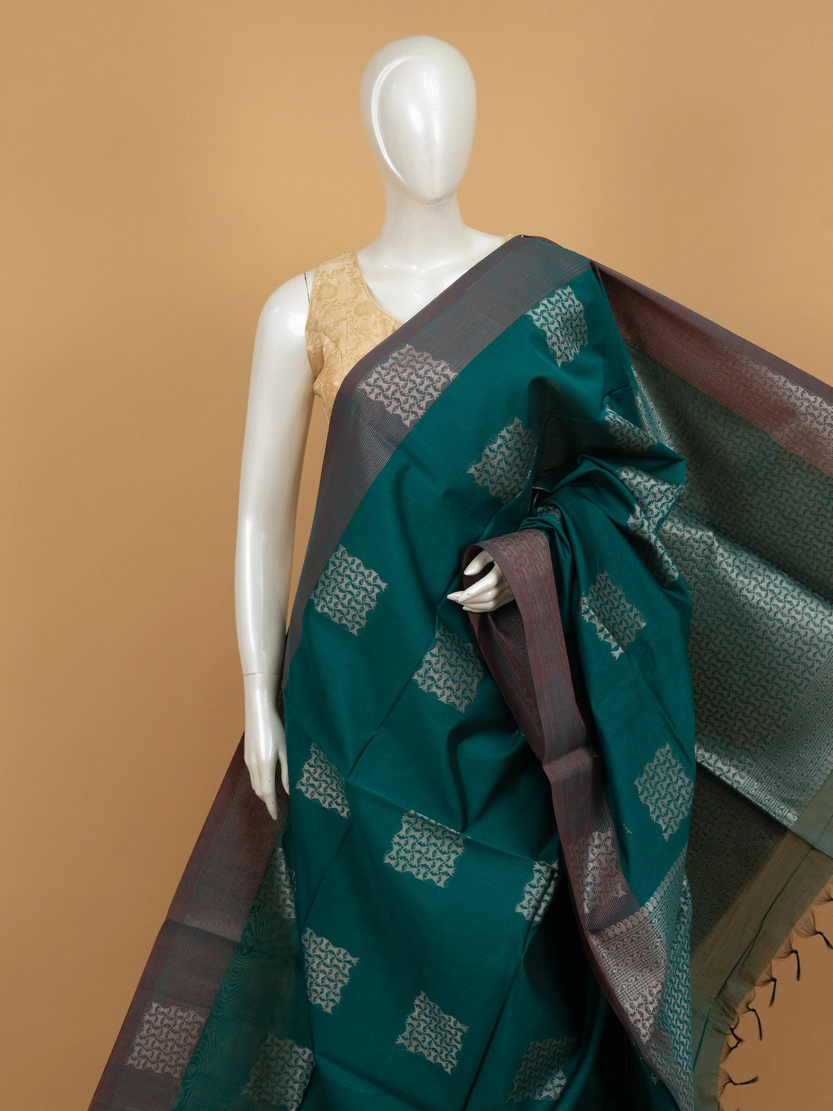 Teal green silk cotton saree with silver zari butta and contrast maroon border