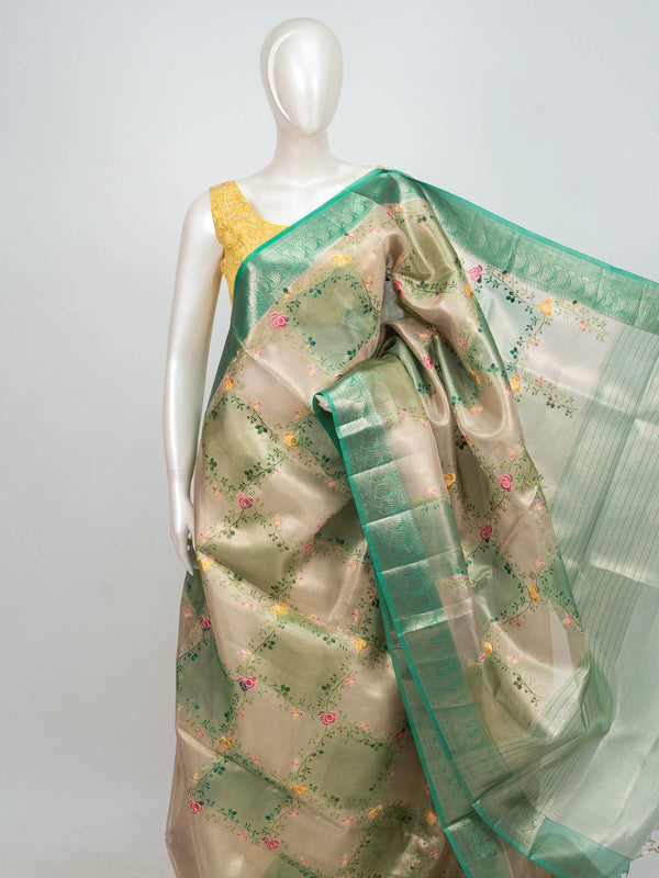 Cream and green semi raw silk saree with multicoloured floral vines and a green zari border