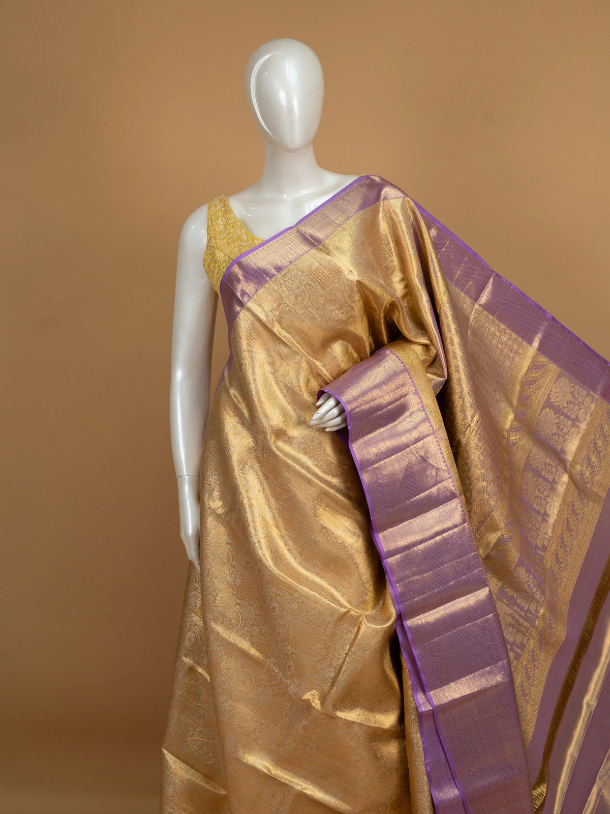 Gold pure Kanchipuram silk saree with contrast lavender zari border and peacock motif pallu