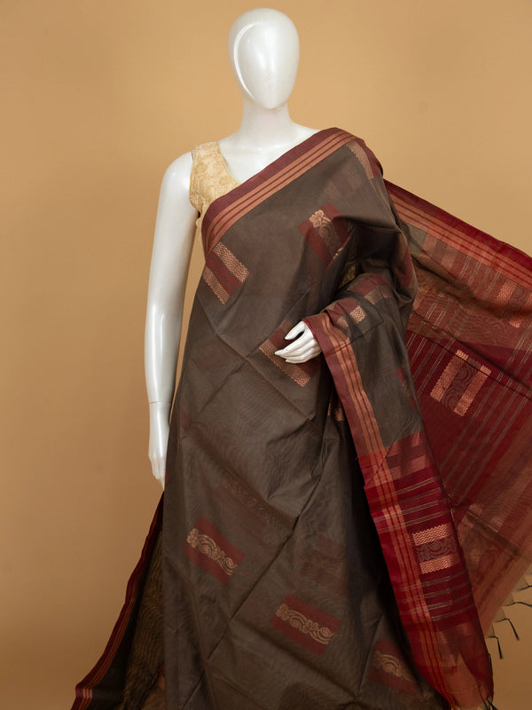 Brown silk cotton saree with contrast maroon border and copper zari butta motifs