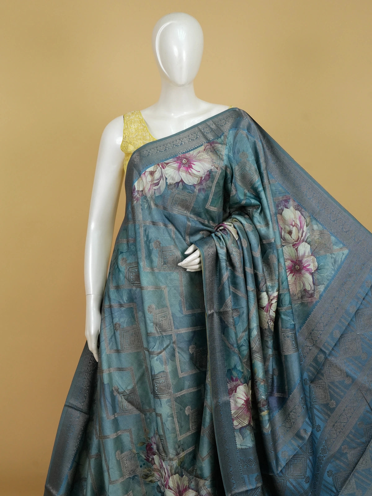 Teal blue semi tussar saree with floral print, diamond zari grid and contrast geometric border