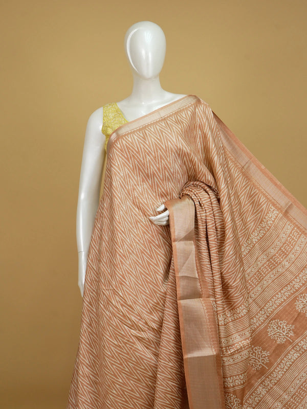 Peach and white designer saree with chevron print, gold zari border and tree-of-life pallu