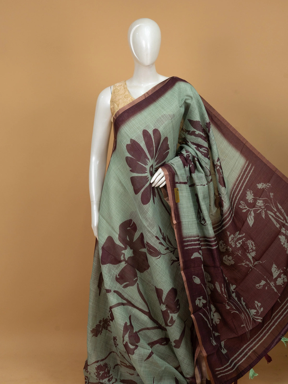 Sage green linen cotton saree with maroon floral prints and contrast maroon border