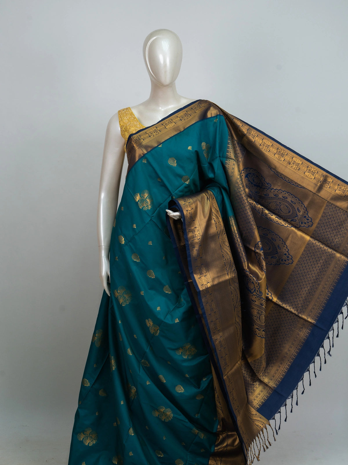 Peacock teal Kanchipuram Fancy Silk saree with contrast navy border and gold zari paisley pallu
