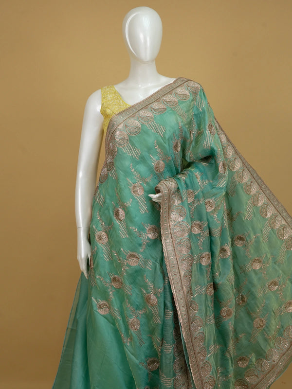 Sea green designer saree with gold zari floral embroidery and embellished scalloped border