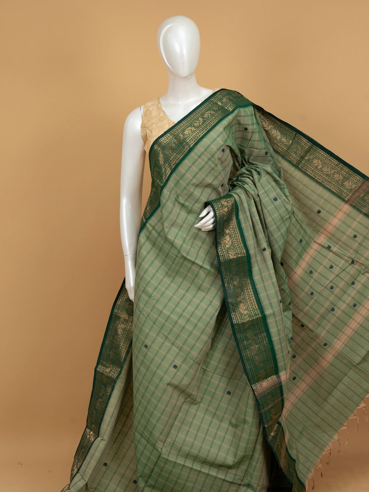 Green checked Chettinad cotton saree with navy buttas and contrast gold zari border