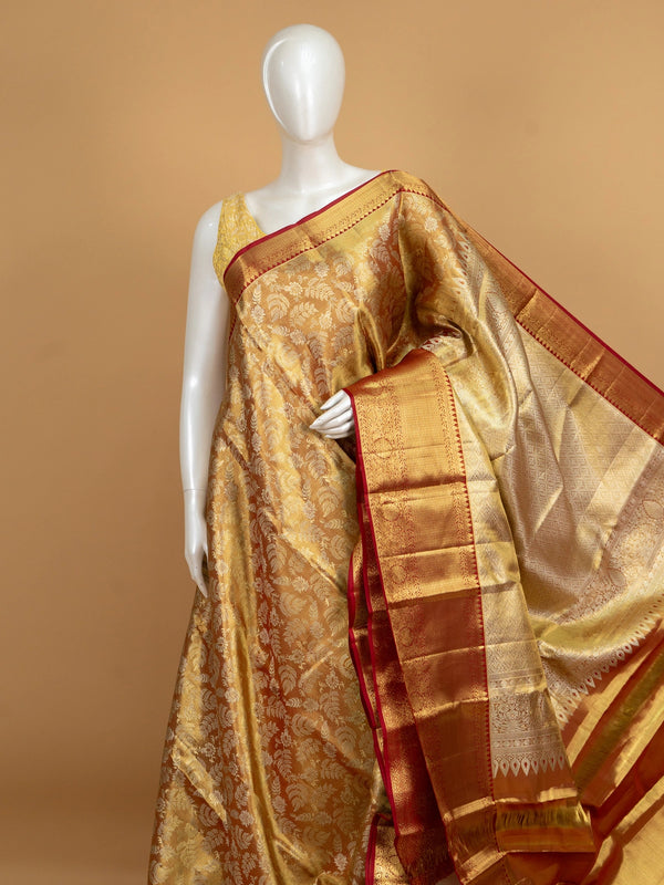 Mustard-gold pure Kanchipuram silk saree with gold zari floral jaal and contrast red zari border