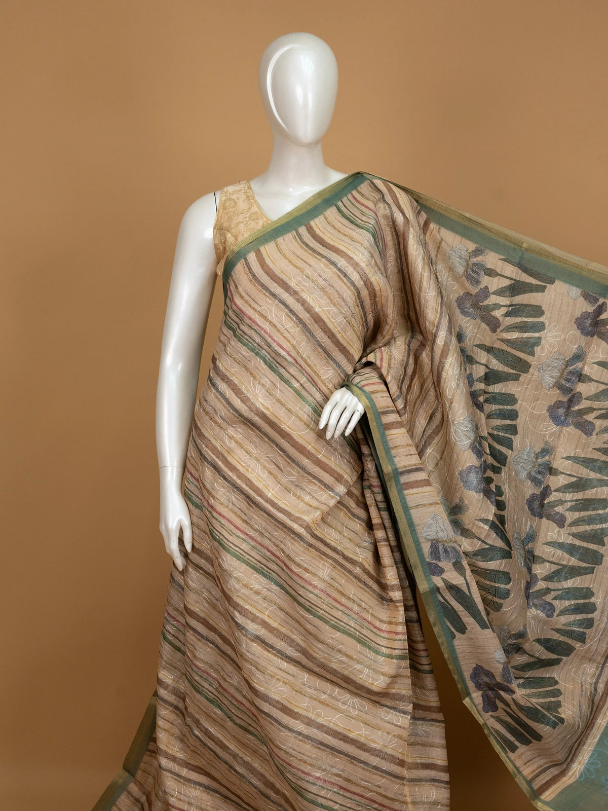 Beige and green linen cotton saree with striped body, floral iris pallu and green zari border