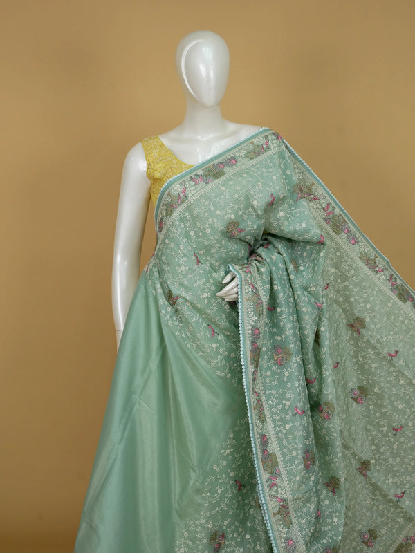 Sage green art silk designer saree with floral, bird and elephant thread embroidery and contrast aqua border