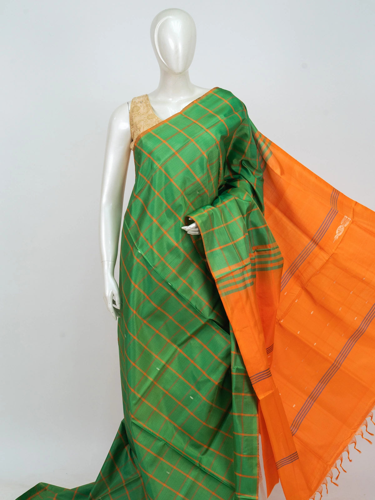 Green and orange checked banana silk saree with contrast orange pallu and blouse