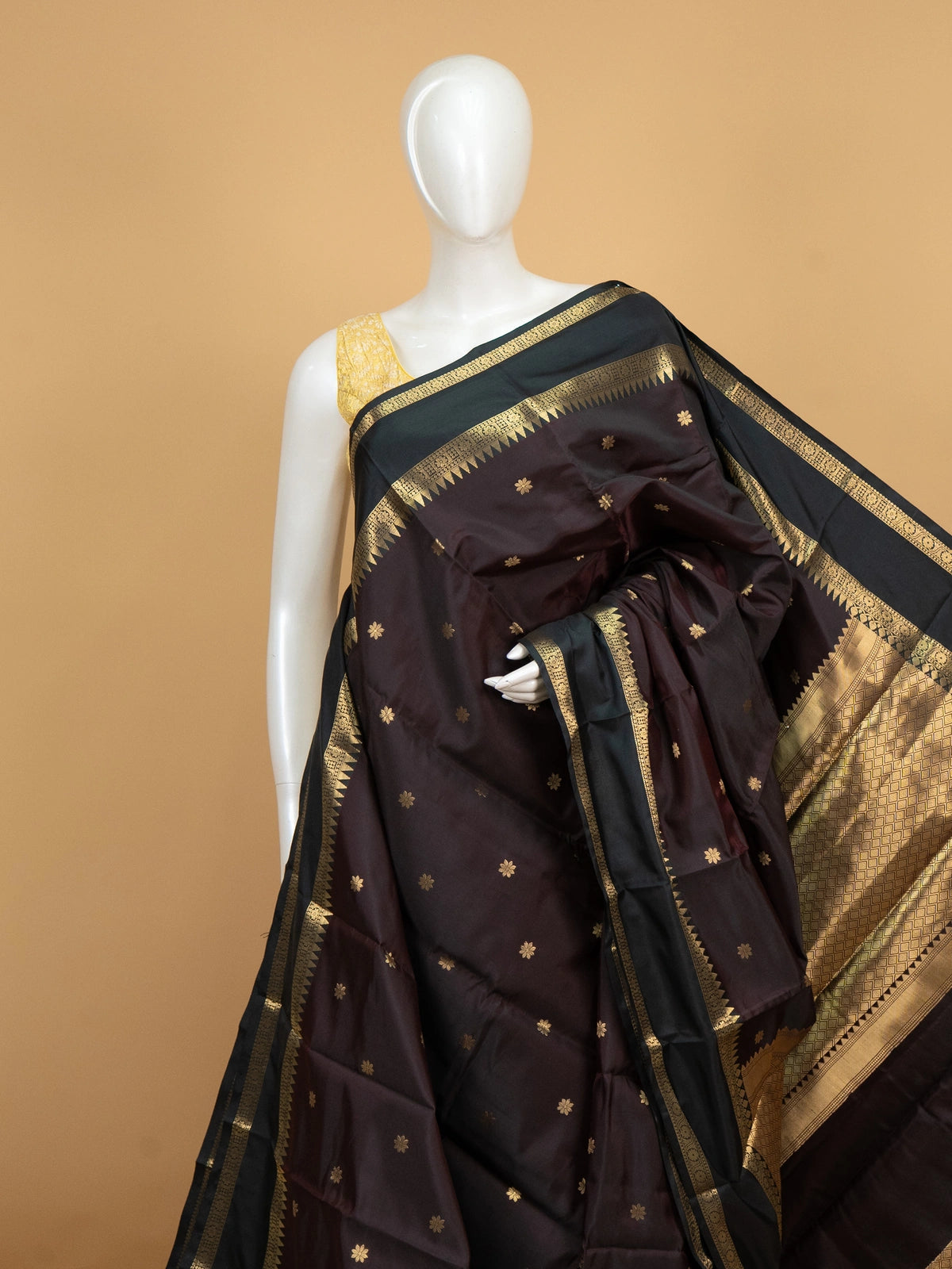 Wine brown Kanchi semi silk saree with contrast green and gold zari border and floral buttas