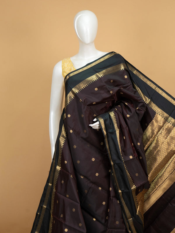 Wine brown Kanchi semi silk saree with contrast green and gold zari border and floral buttas