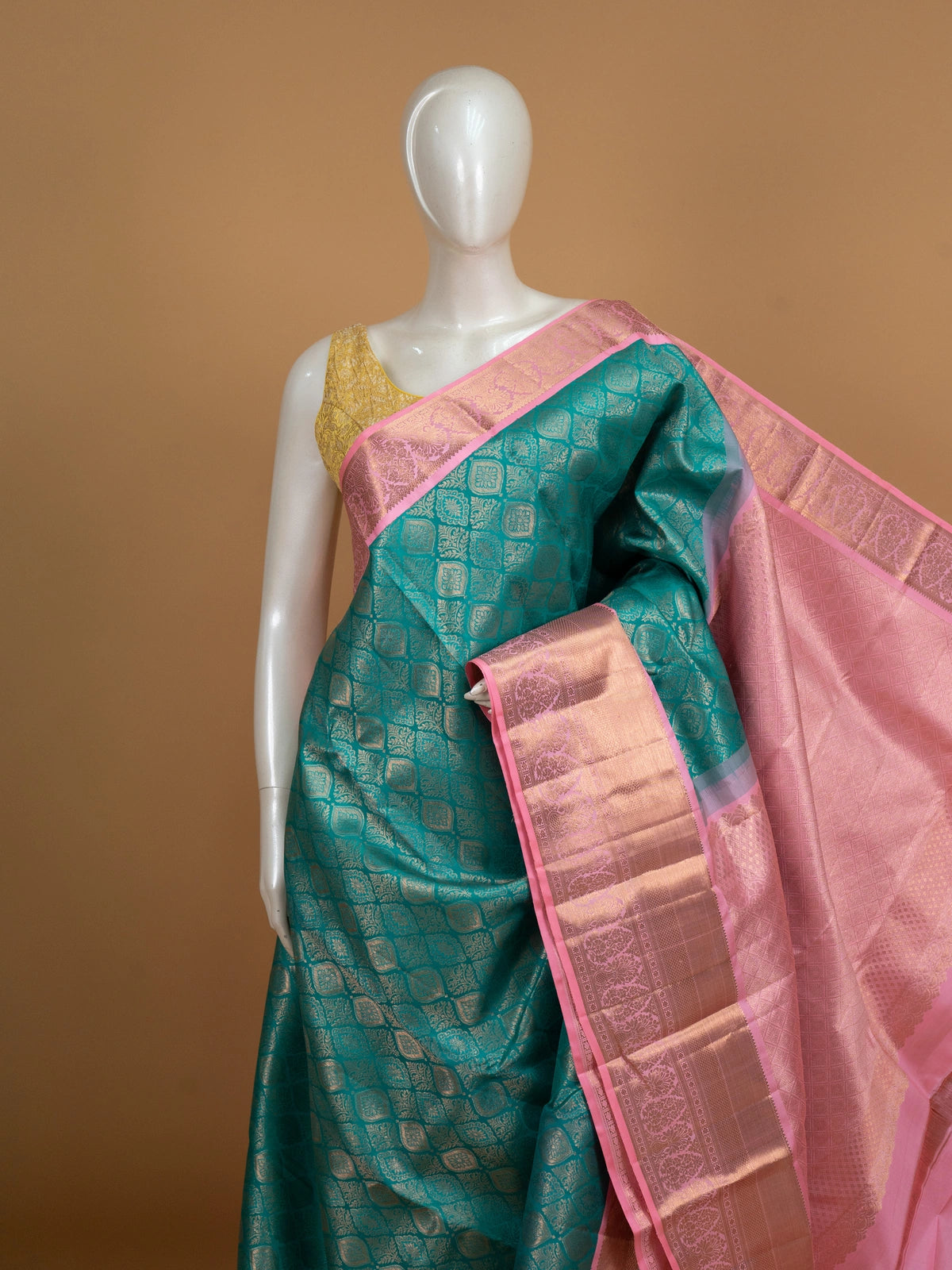 Teal green pure Kanchipuram silk saree with gold zari brocade body and contrast pink zari border
