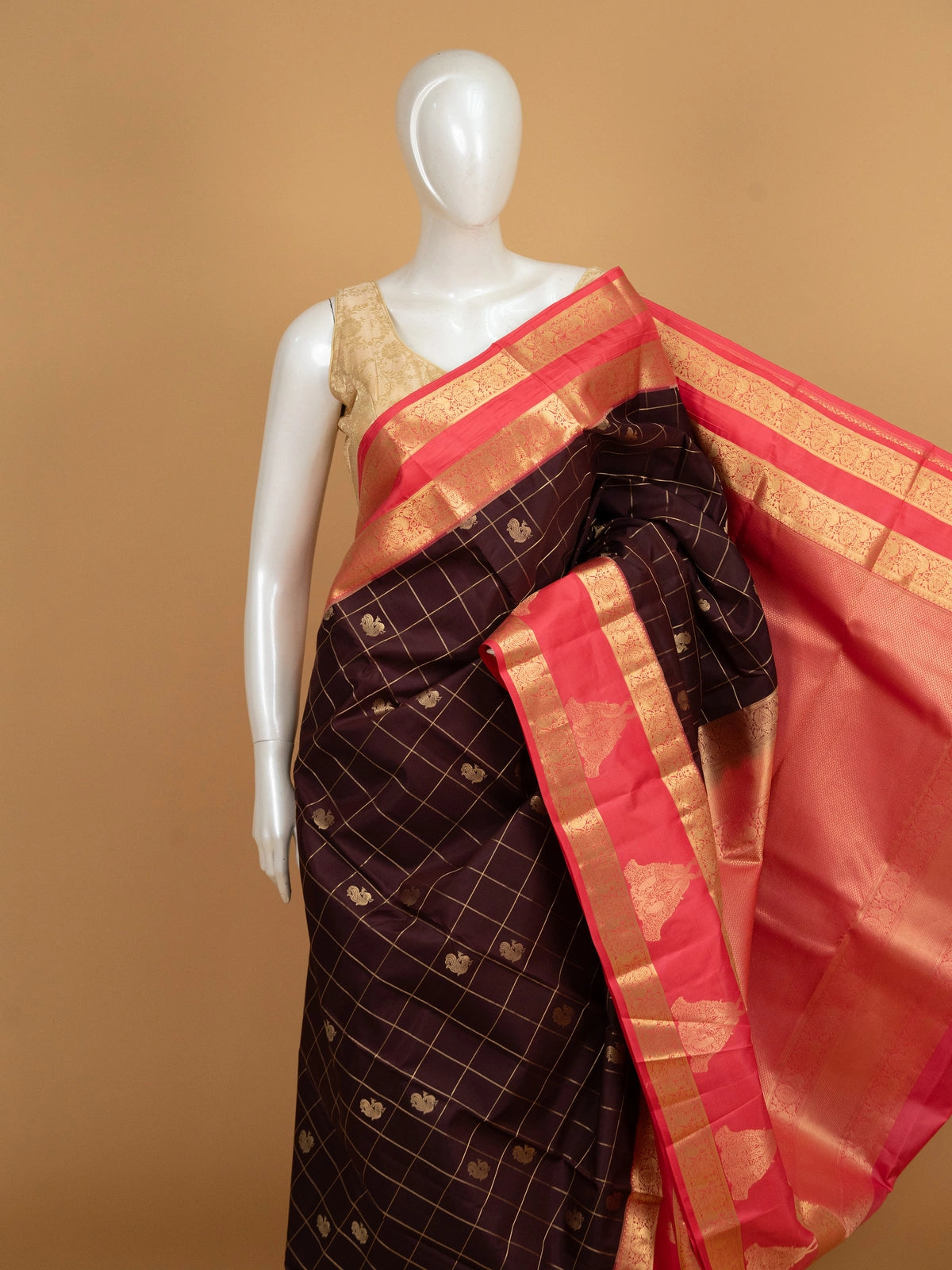 Deep wine pure Kanchipuram silk saree with gold zari checks, peacock motifs and coral pink contrast zari border