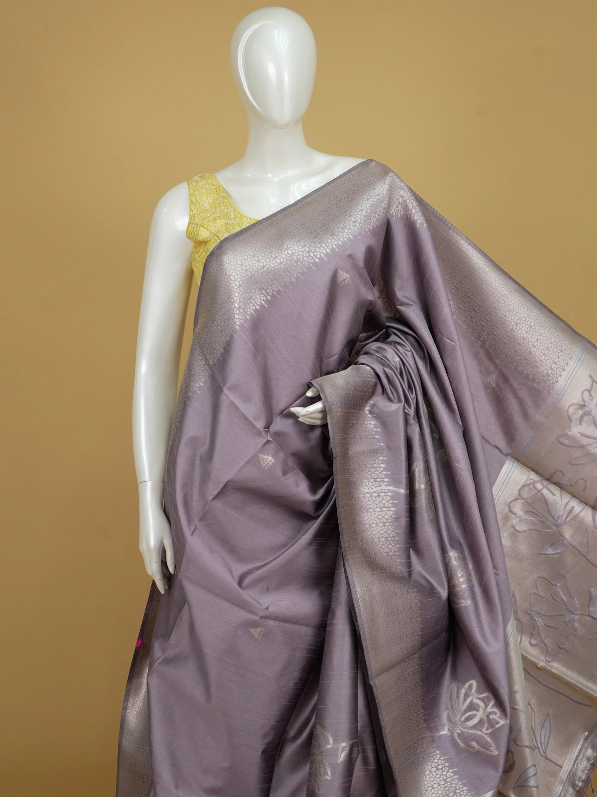 Dusty mauve semi tussar saree with silver zari floral pallu and geometric border