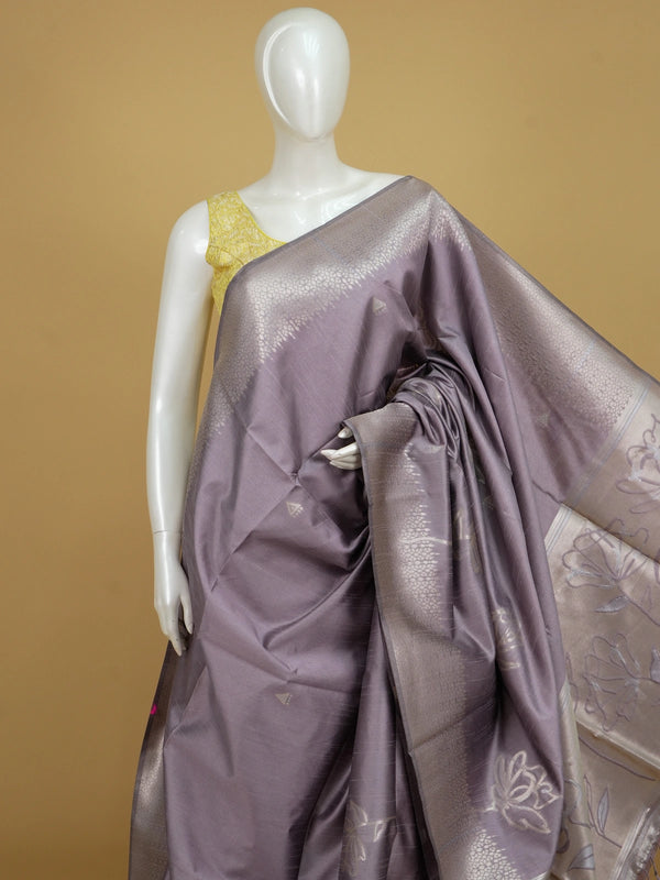 Dusty mauve semi tussar saree with silver zari floral pallu and geometric border