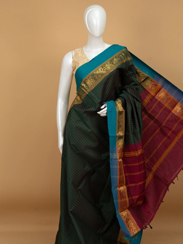 Bottle green Chettinad cotton saree with mustard pinstripes, teal gold zari border and maroon striped pallu