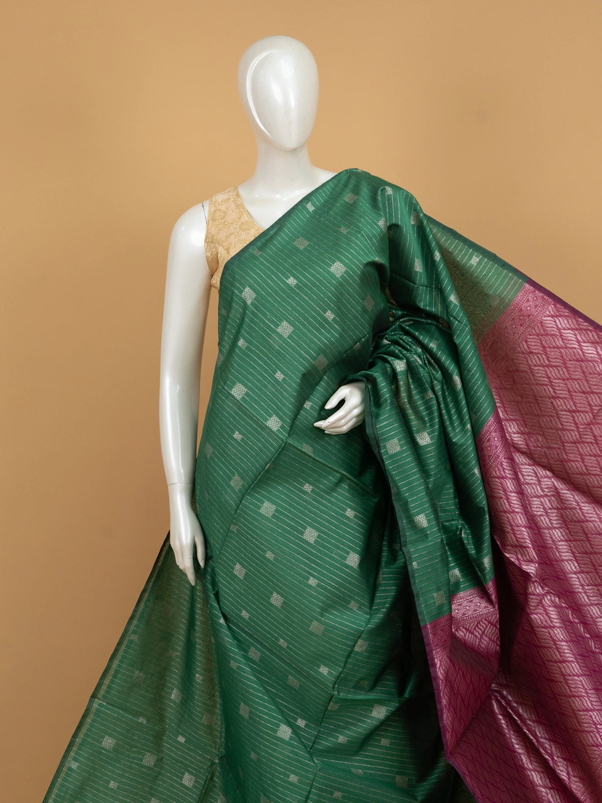 Bottle green silk cotton saree with silver zari stripes and contrast magenta border and pallu