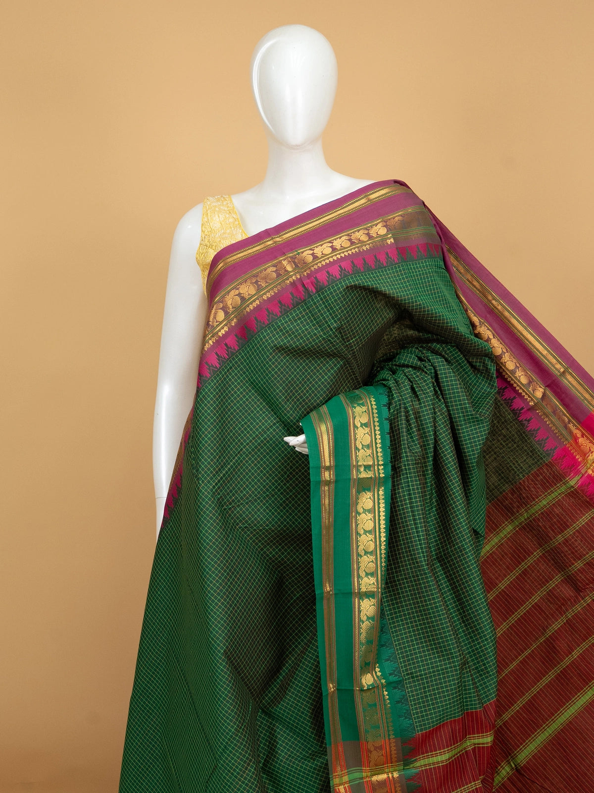 Green Chettinad cotton saree with checked body, contrast magenta gold zari border, and maroon pallu