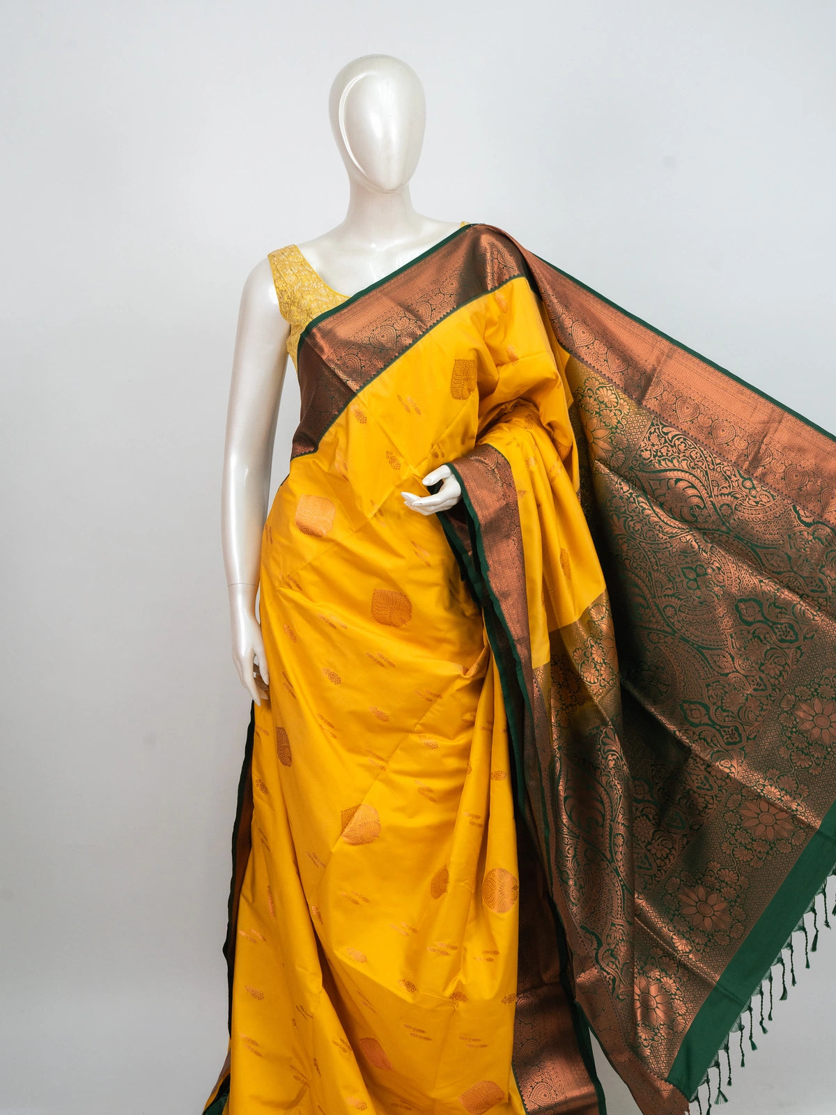 Yellow Kanchipuram fancy silk saree with green contrast border and copper zari pallu