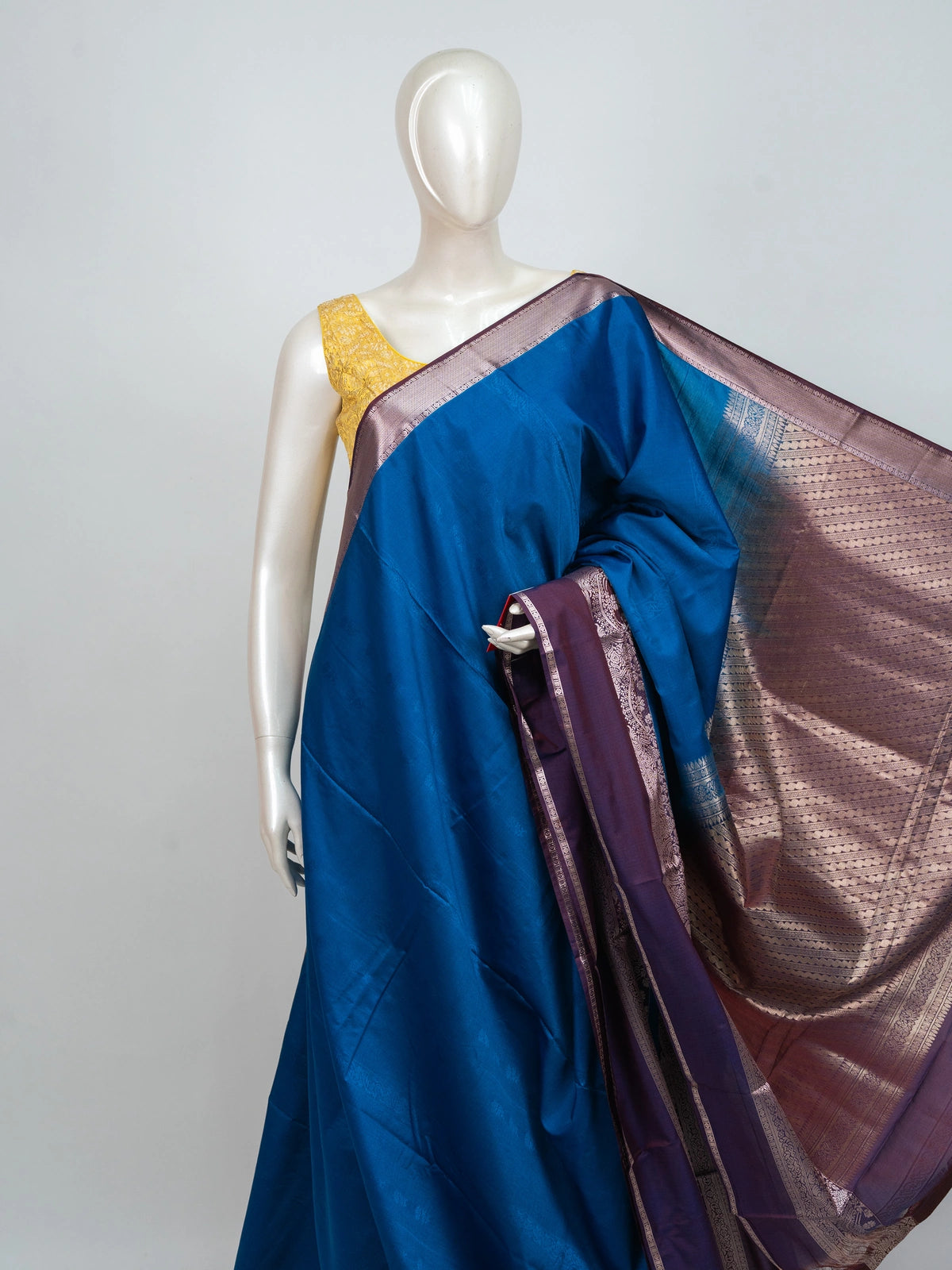 Peacock blue semi silk saree with contrast purple border and silver zari pallu