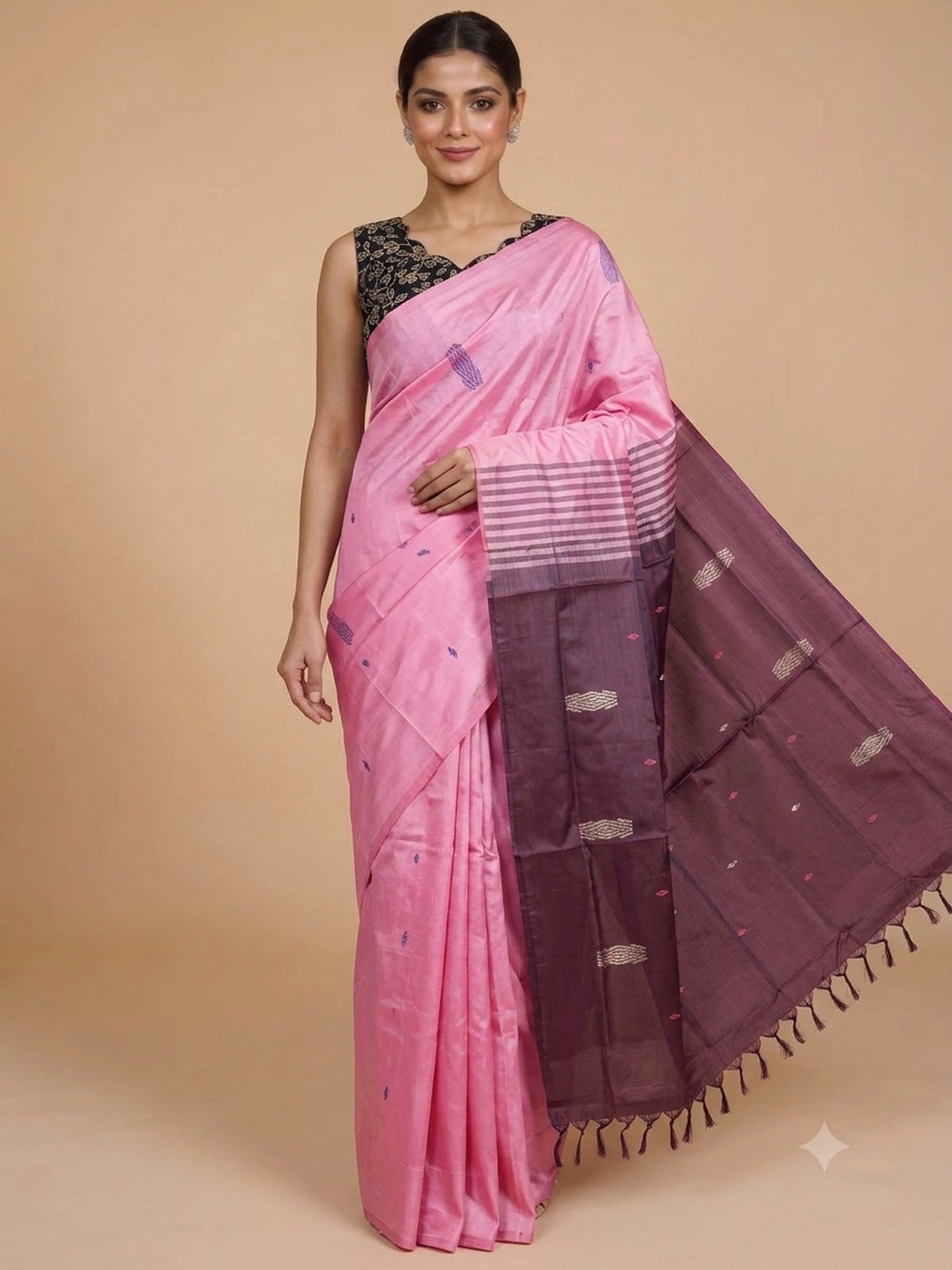 Pink banana silk saree with contrast maroon pallu, woven buti motifs, and black floral blouse