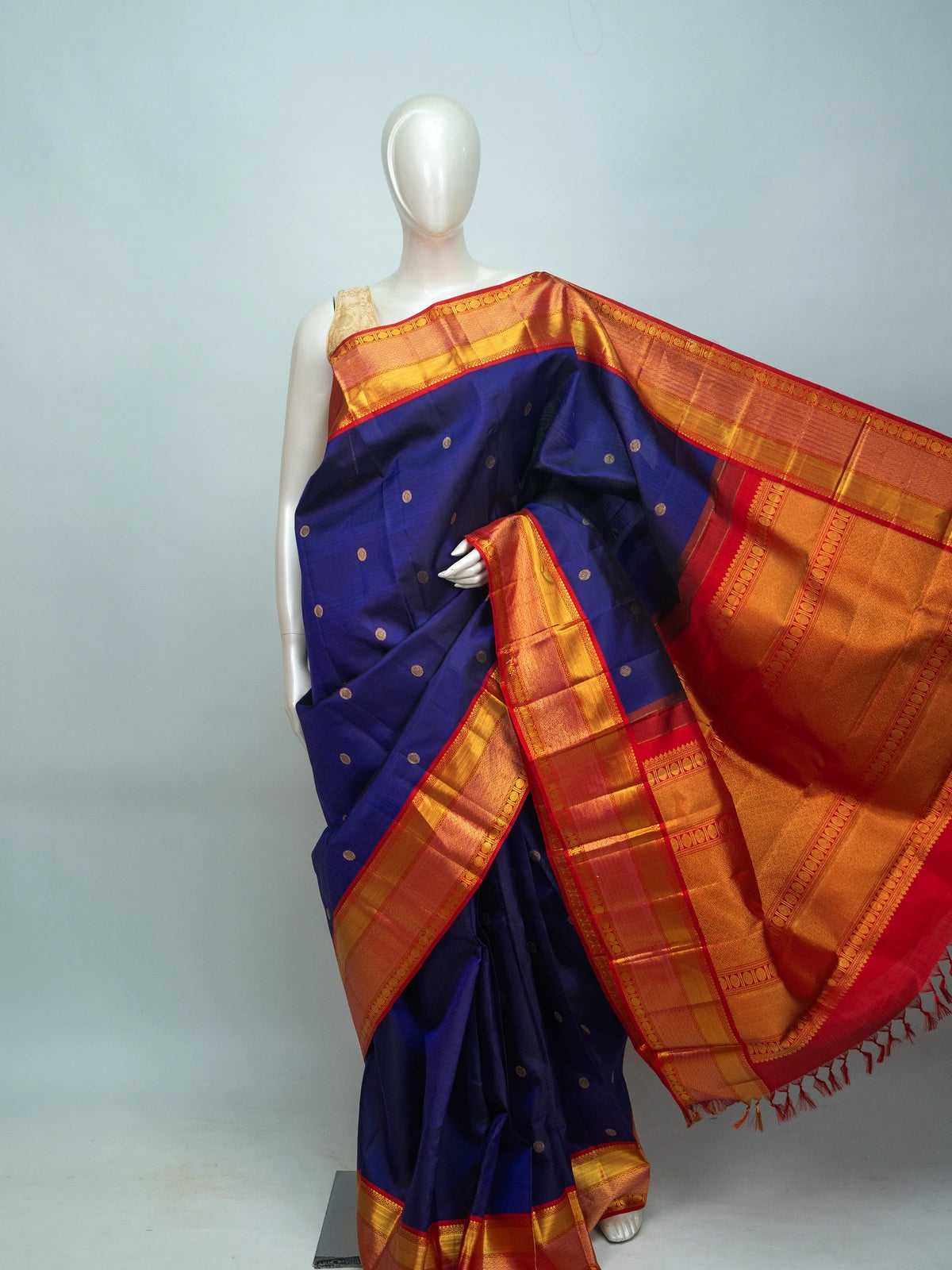 Navy blue pure Kanchipuram silk saree with contrast red gold zari border and pallu
