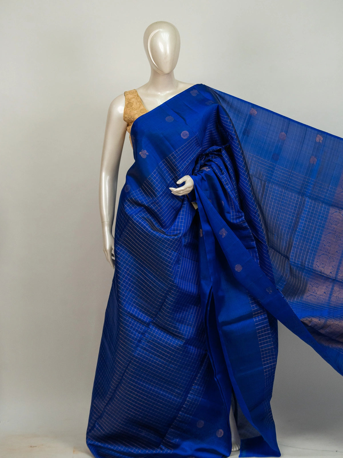 Royal blue pure soft silk saree with gold zari checks, peacock buttas and zari border