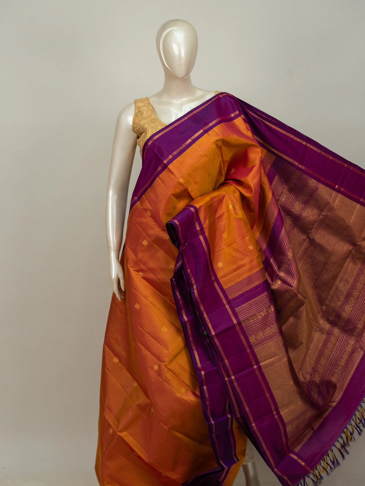 Orange and purple pure Kanchipuram silk saree with gold zari border and traditional motif pallu